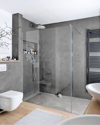 salle de bain avec douche italienne en béton ciré